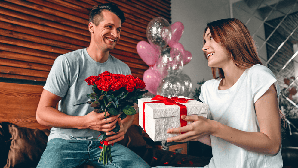 Husband Giving Gifts To His Wife