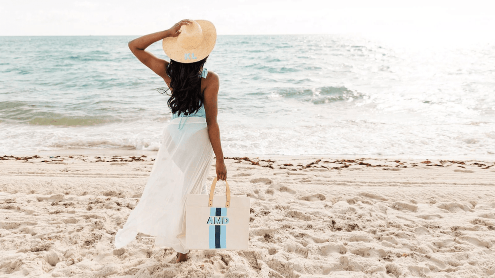 Woman In Swimsuit Carrying a Beach Bag