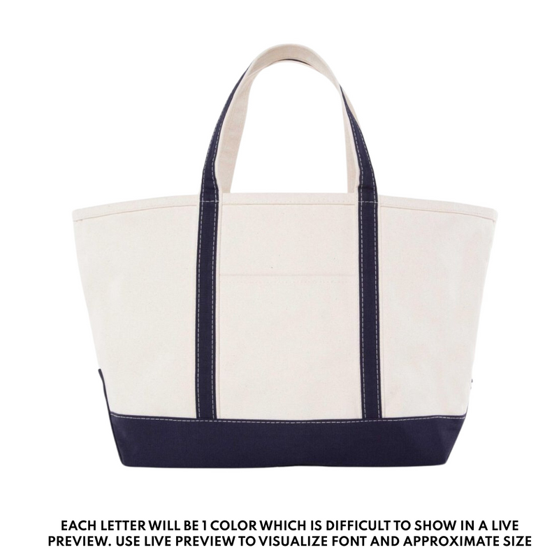 Classic canvas teacher tote bag with navy handles and trim, embroidered with custom name or text.