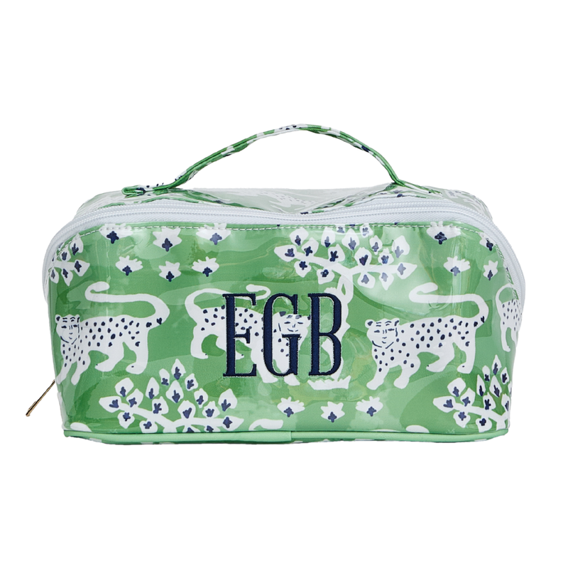 A clear-coated toiletry pouch in a green leopard and floral print, monogrammed 'EGB' in navy
