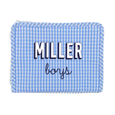 Light blue gingham TRVL Roadie pouch embroidered 'Miller boys' in navy block and script lettering, on a white background.