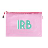 Pink mesh pool bag with a red zipper appliqued 'IRB' in white and teal, on a white background.