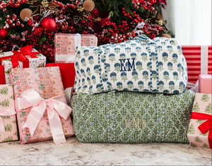 Block print duffel bag with green floral pattern, stylish travel essential.