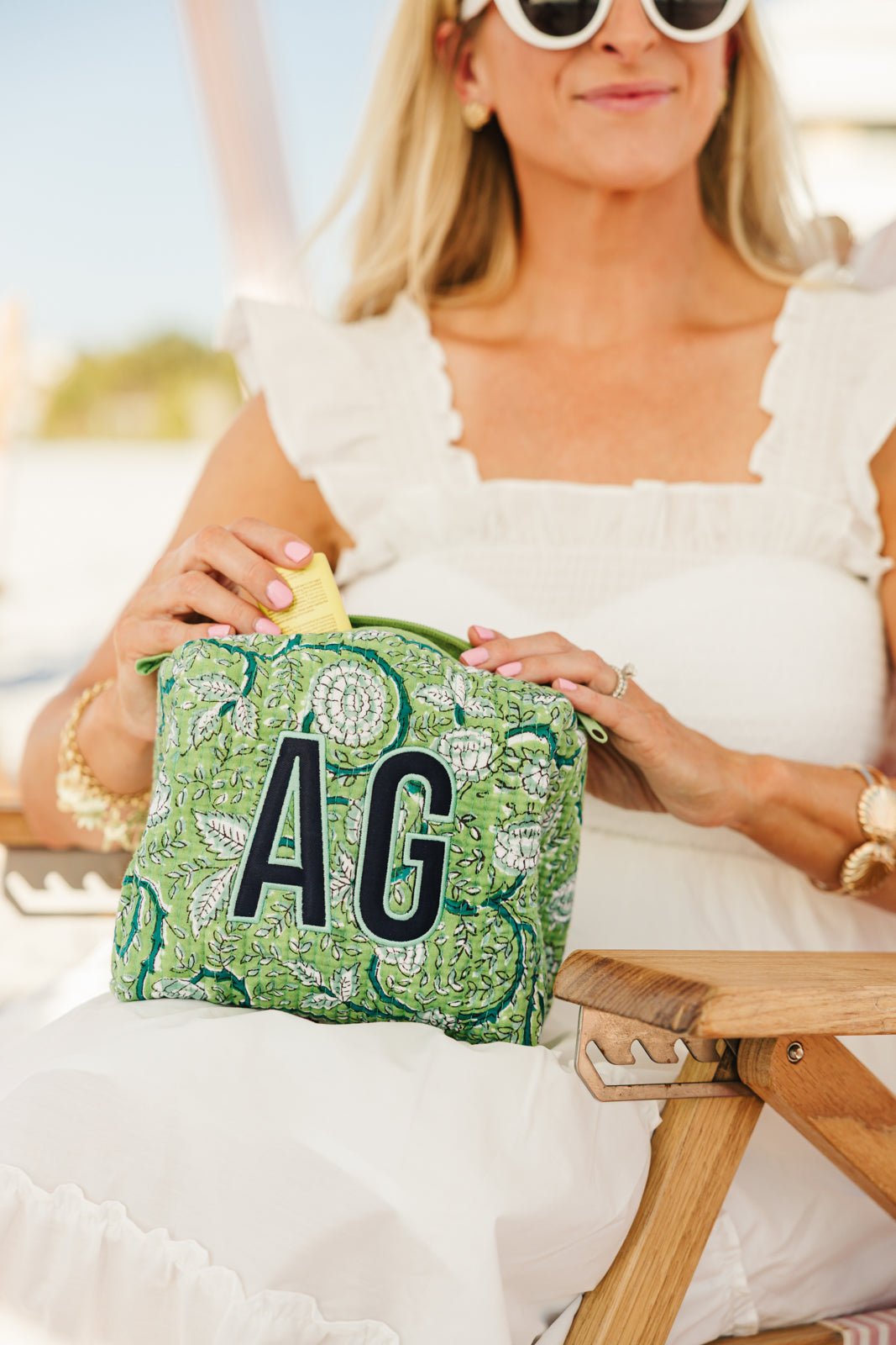 A colorful set of three Embroidered Block Print Pouches with Applique, featuring custom monograms in bold, vibrant thread. Each pouch displays a unique floral block print design in blue, purple, and pink tones, making them perfect for personalized travel or cosmetic storage.