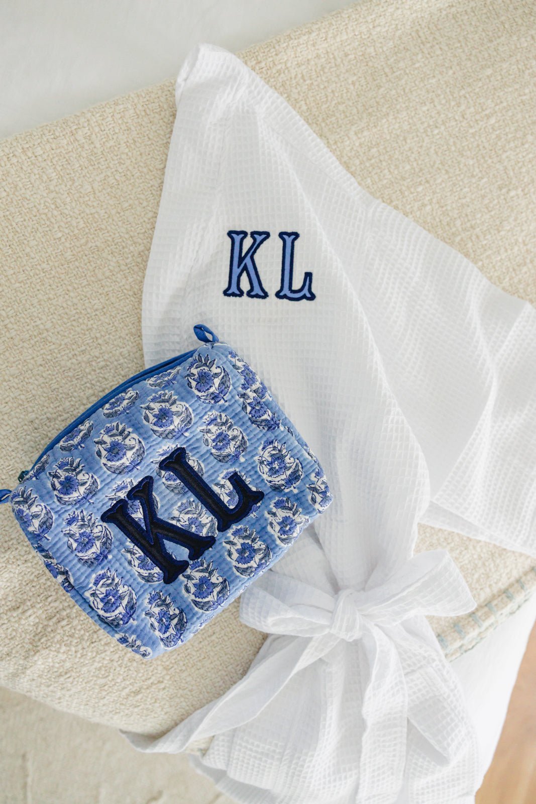 Block Print Gift Bundle with Applique featuring 5 color options each embroidered block print pouch and a white waffle knit robe, both customized with matching pink applique initials for a personalized and thoughtful gifting set.