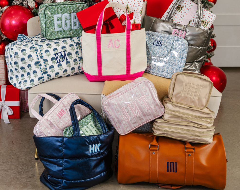 Cozy holiday collection with personalized totes and pouches under the tree.