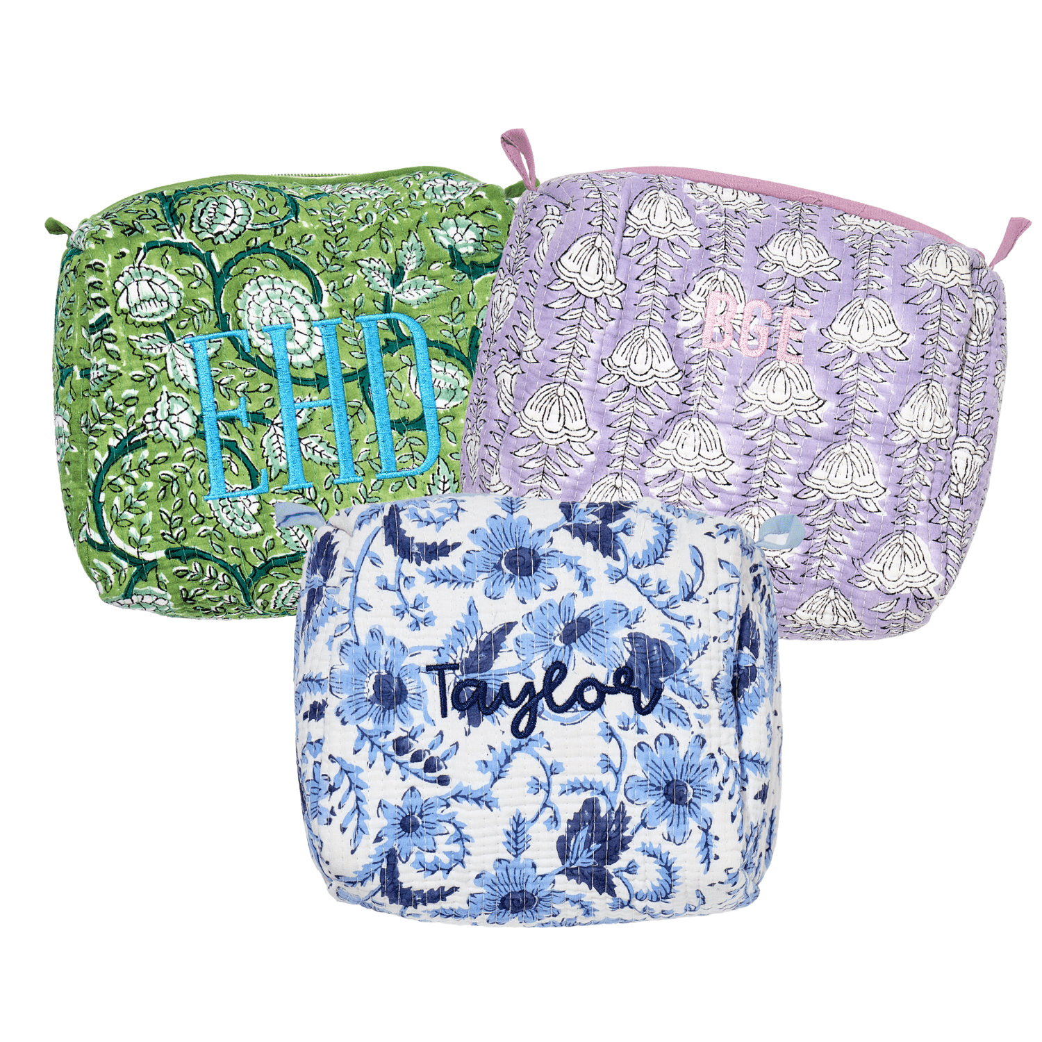 Assorted Embroidered Block Print Pouches in vibrant green, pink, lavender, and blue floral patterns with personalized monograms—perfect for travel or everyday use.