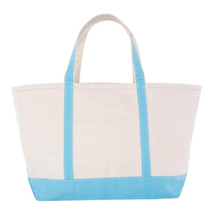 Natural canvas gameday tote with baby-blue trim and front pocket, customizable embroidery.