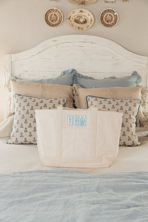 White embroidered tote with applique initials, durable and versatile.