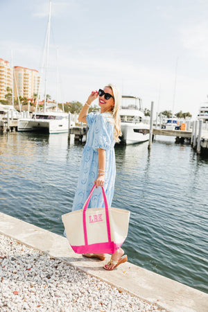 Embroidered canvas tote with bold pink applique letters, eye-catching design.