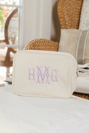 Extra-large canvas pouch with monogram embroidery, versatile and durable organizer.
