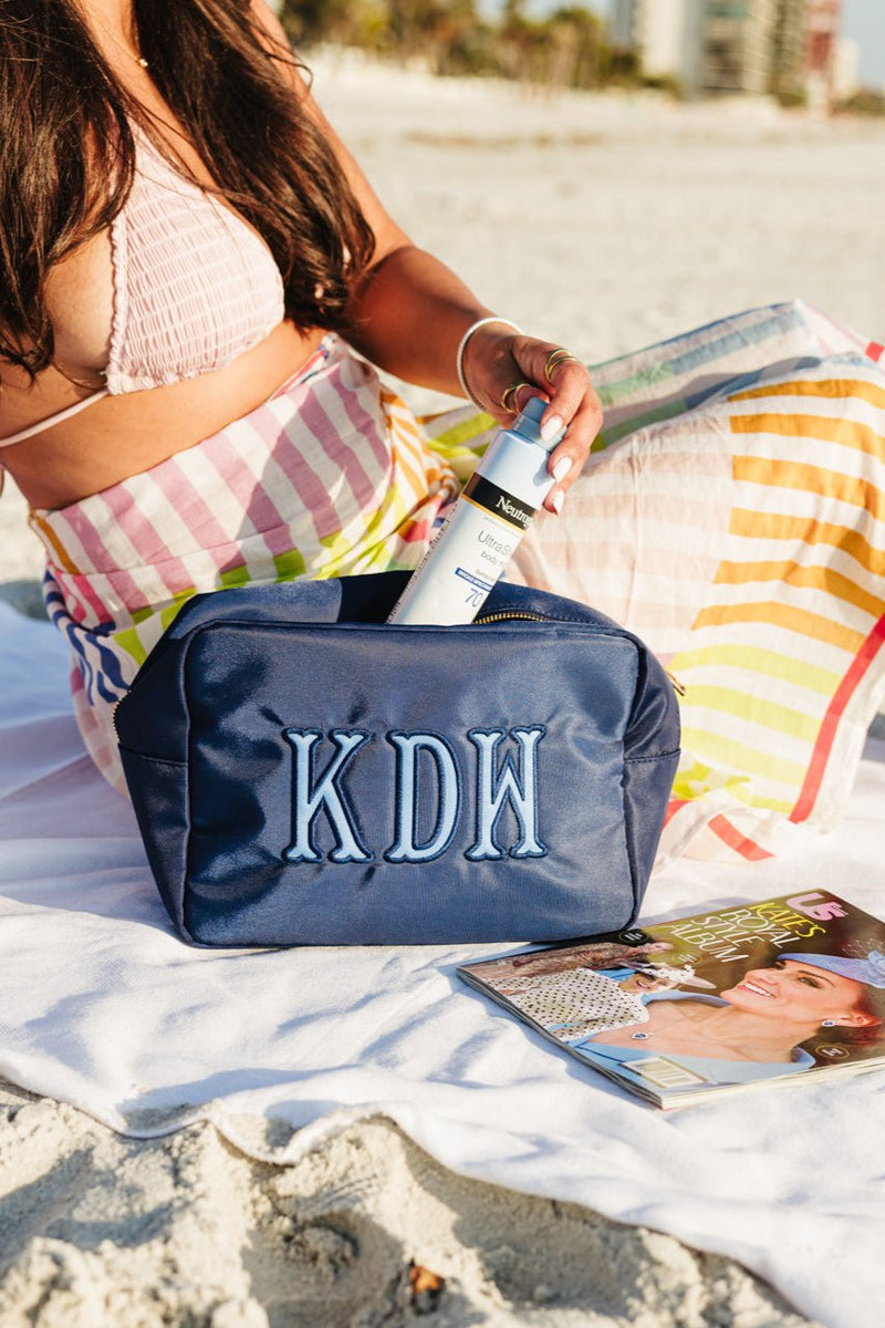 Embroidered monogrammed travel pouch, oversized for beauty or beach essentials.