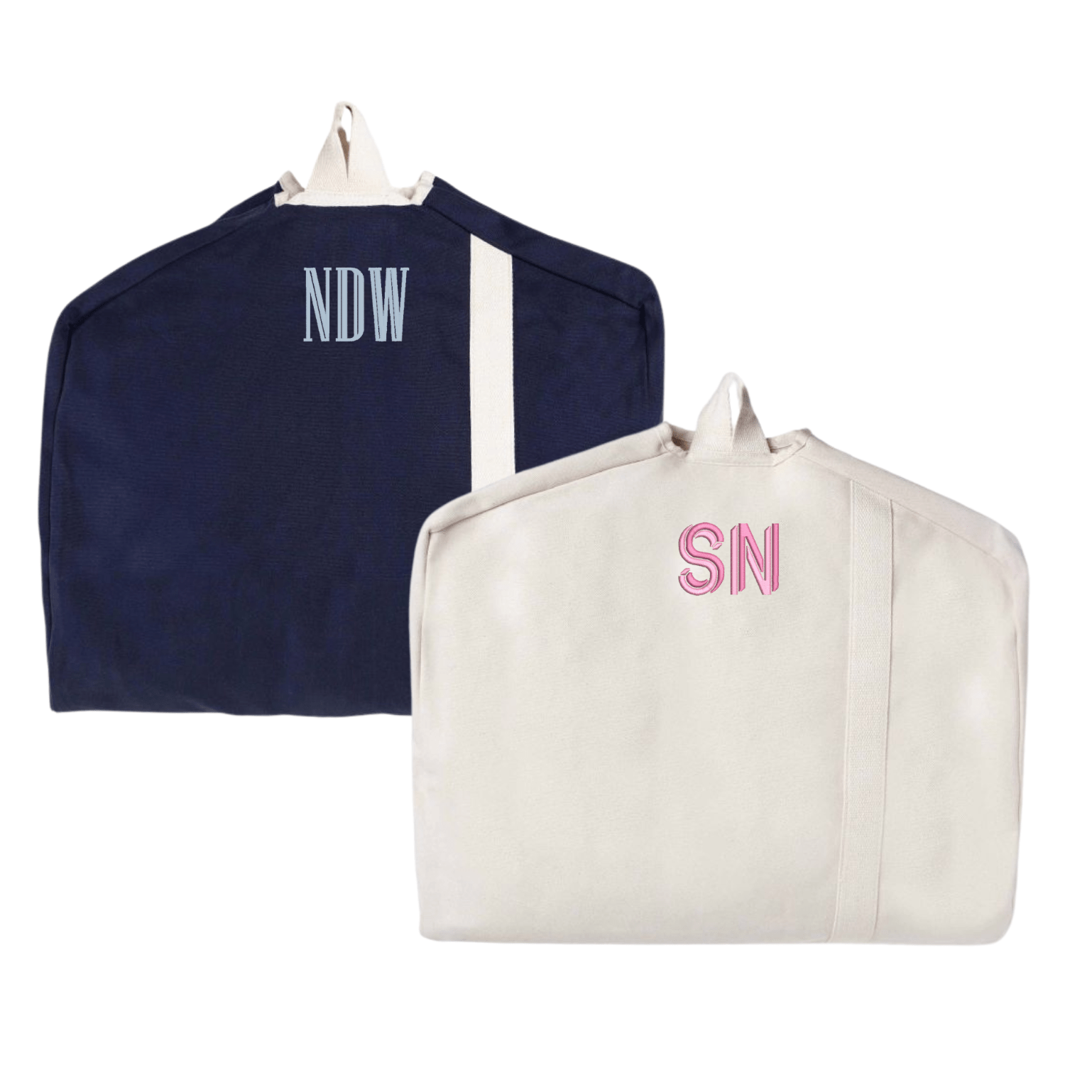 A stylish set of two personalized garment bags in navy and beige, each featuring custom monogram embroidery. The navy bag showcases "NDW" in light blue thread, while the beige bag is adorned with "SN" in soft pink. Designed for travel and organization, these canvas garment bags offer a chic and functional way to protect clothing while on the go.