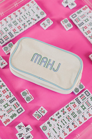 Monogrammed embroidered large canvas pouch with applique detailing in pink.