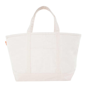 Canvas tote bag with structured silhouette, wide base, and sturdy top handles