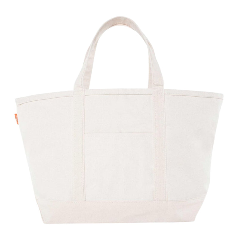 Canvas tote bag with structured silhouette, wide base, and sturdy top handles