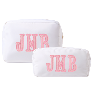 Blue nylon pouch set in large and extra-large sizes with embroidered monogram.