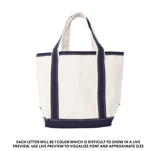 Teacher tote bag with navy trim and handles, embroidered with custom name or initials.