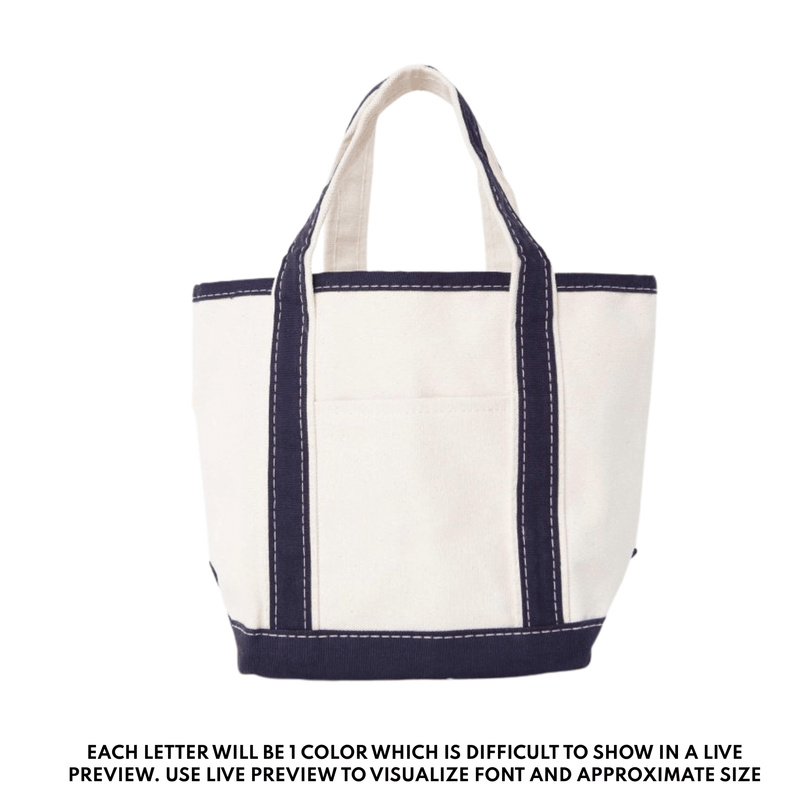 Teacher tote bag with navy trim and handles, embroidered with custom name or initials.