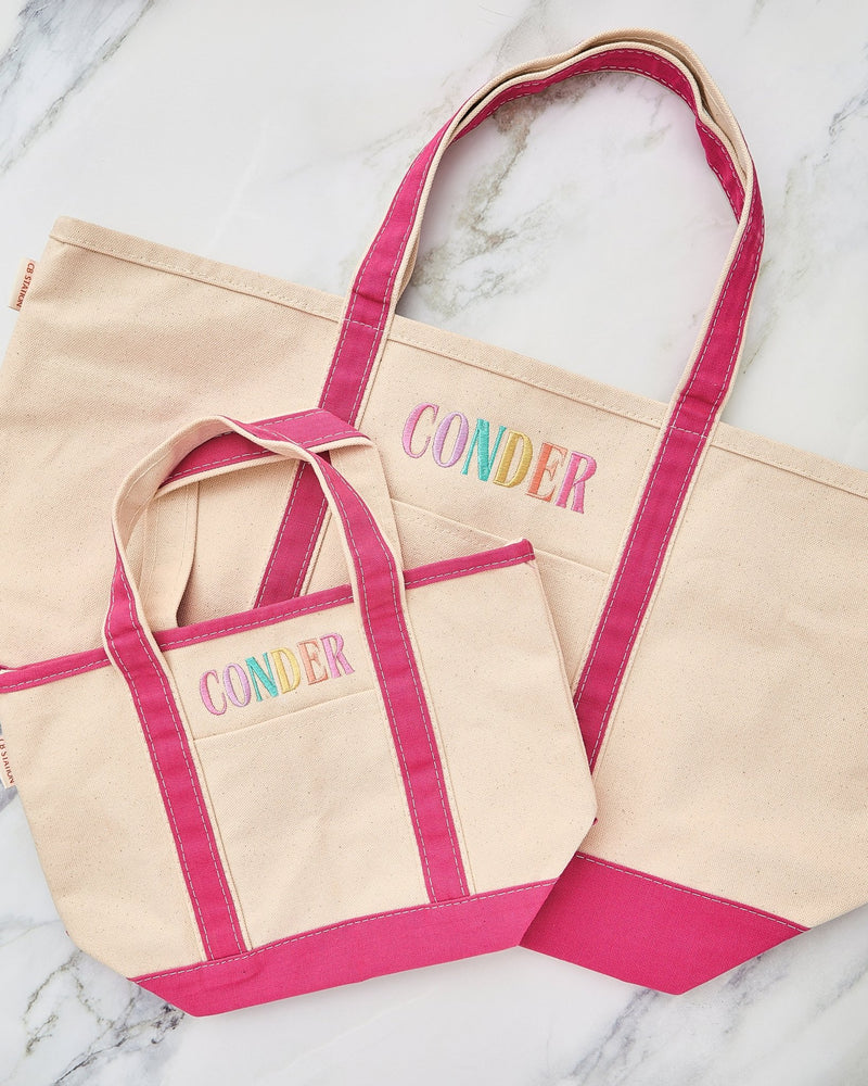 Two Embroidered Teacher Canvas Totes – @PBANDJ4THGRADE x SWP in natural canvas with hot-pink trim, personalized “CONDER” embroidery, small and large sizes