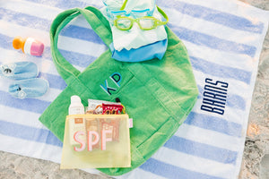 Green embroidered terry tote bag with monogram, perfect for summer and travel gifting.