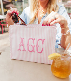 Personalized embroidered TRVL Roadie bag with custom monogram, stylish travel case for organizing essentials.