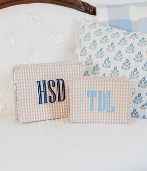 Monogrammed TRVL Roadie cosmetic bag in pastel print chic and functional personalized travel organizer.