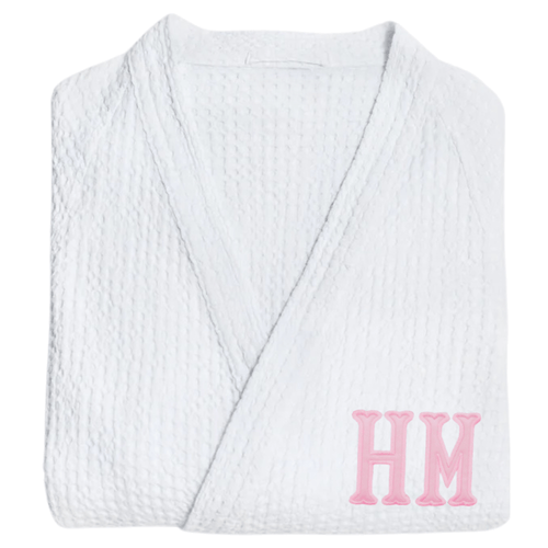 White waffle knit robe with large pink appliqué monogram design.