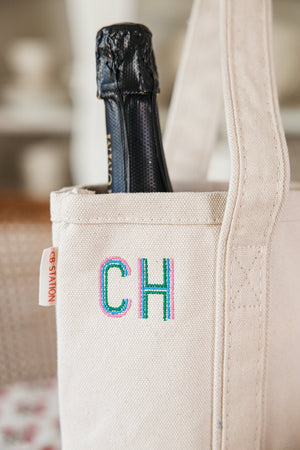 Monogrammed wine tote in neutral canvas with blue initials