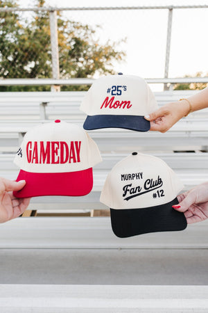 Bleachers scene featuring the puff-embroidered “GAMEDAY” cap.
