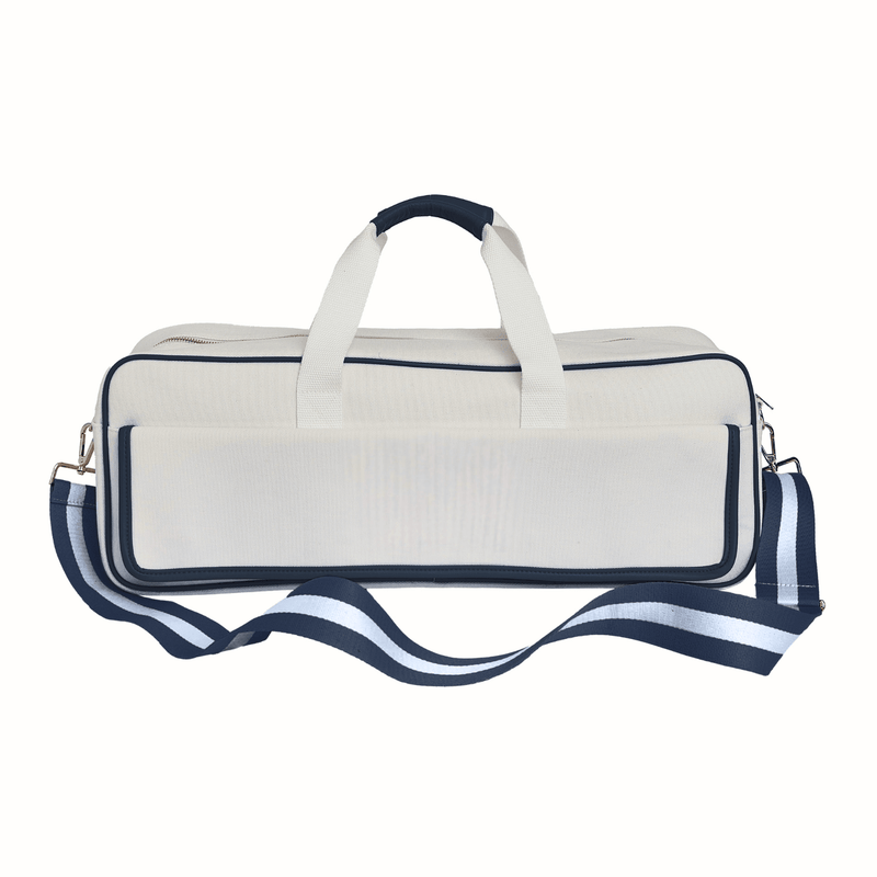 Blank white canvas mahjong carryall duffel with navy trim and a navy and white striped strap, no monogram, on a white background