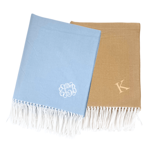 Blue and camel Monogrammed Woven Blankets with white fringe and personalized embroidery initials.