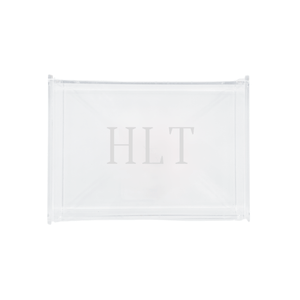 A sleek and modern personalized acrylic tray monogrammed with 'HLT,' perfect for stylish organization and display. This transparent, minimalist design seamlessly complements any home décor, making it an ideal gift or chic storage solution. Pair it with other customized accessories for a cohesive and elegant set.
