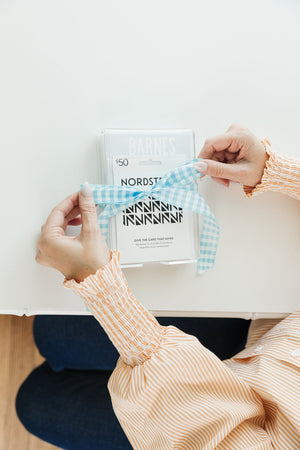 Sleek personalized acrylic notepad holder, perfect as a thoughtful and functional desk gift.