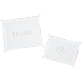 A set of two personalized acrylic trays featuring elegant monogrammed designs—one with the name 'WILLIAMS' and the other with initials 'EBG.' These chic and versatile catch-all trays add a stylish touch to any space, perfect for organizing small essentials on a desk, dresser, or entryway. Pair them with other custom acrylic accessories for a coordinated look