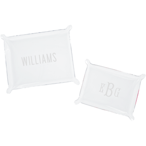A set of two personalized acrylic trays featuring elegant monogrammed designs—one with the name 'WILLIAMS' and the other with initials 'EBG.' These chic and versatile catch-all trays add a stylish touch to any space, perfect for organizing small essentials on a desk, dresser, or entryway. Pair them with other custom acrylic accessories for a coordinated look