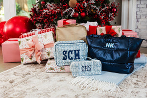 Holiday-ready puffer tote bag in navy, custom embroidered initials.