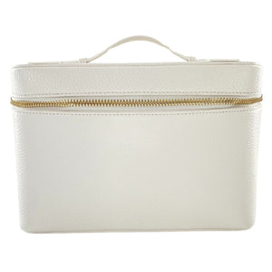 Light neutral leather train case with shadow monogram, perfect for makeup and travel essentials.