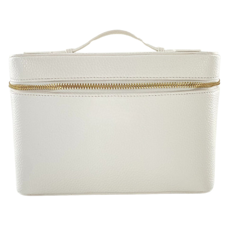 Light neutral leather train case with shadow monogram, perfect for makeup and travel essentials.
