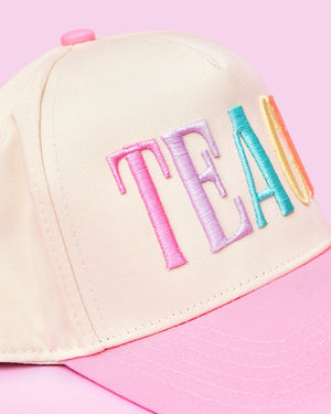 Teach 3D Puff Trucker Hat – @PBANDJ4THGRADE x SWP: cream front panel with pastel 3D “TEACH” embroidery and pink brim