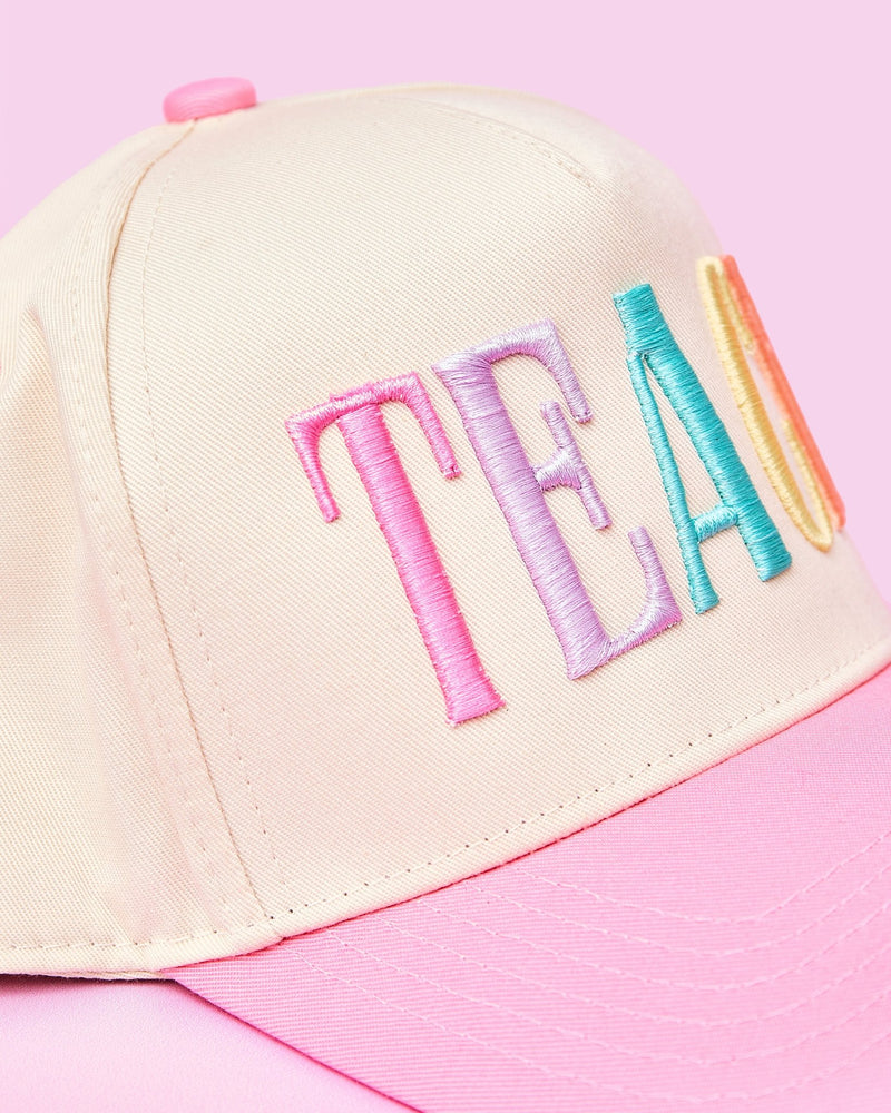 Teach 3D Puff Trucker Hat – @PBANDJ4THGRADE x SWP: cream front panel with pastel 3D “TEACH” embroidery and pink brim