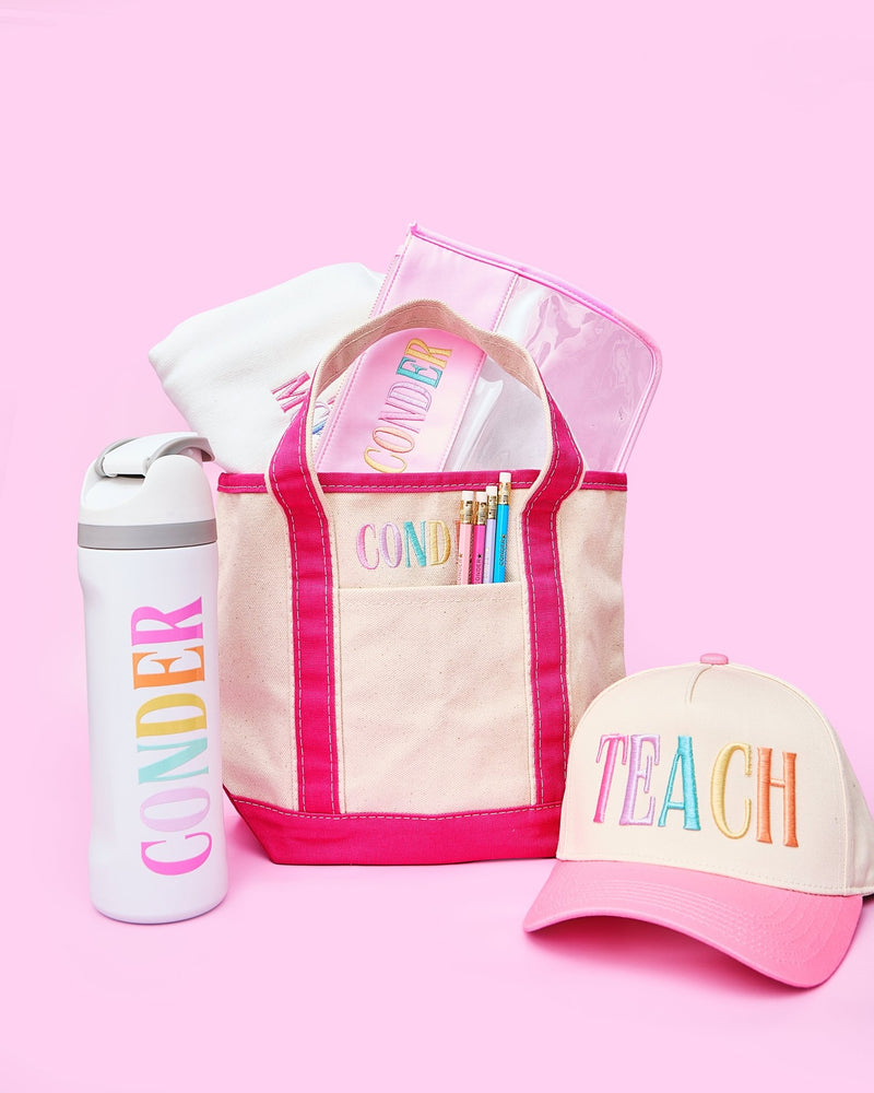 Teacher Essentials Bundle – @PBANDJ4THGRADE x SWP: natural canvas tote with hot-pink trim and front pocket, pastel-monogrammed water bottle, TEACH 3D puff trucker hat, clear nylon pouch with pink trim