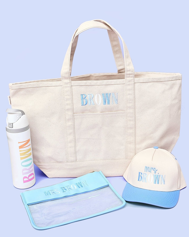 Teacher Essentials Bundle – @PBANDJ4THGRADE x SWP: canvas tote with navy trim, rainbow “BROWN” bottle, blue-brim hat, clear pouch