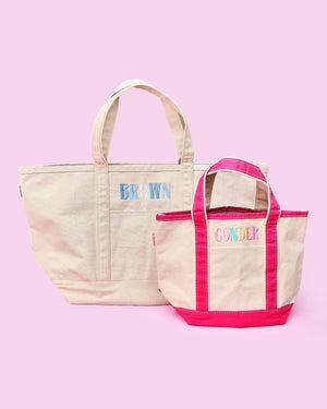 Two embroidered Teacher Canvas Totes – a large natural canvas tote with navy-blue trim and “BROWN” monogram, and a small natural tote with hot-pink trim and “CONDER” monogram