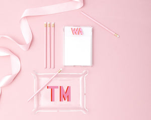 An acrylic tray and notepad are customized with initials