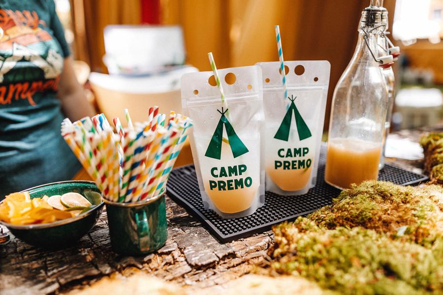 A drink pouch that reads "Camp Premo" with a tent icon 