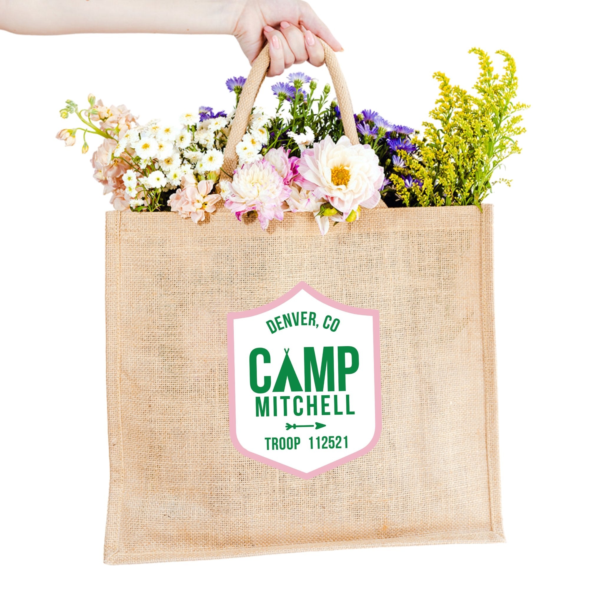 A jute carryall is customized with a green and pink camp logo