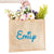 A custom jute bag reads "Emily" on the front in Magic Adventure Park font