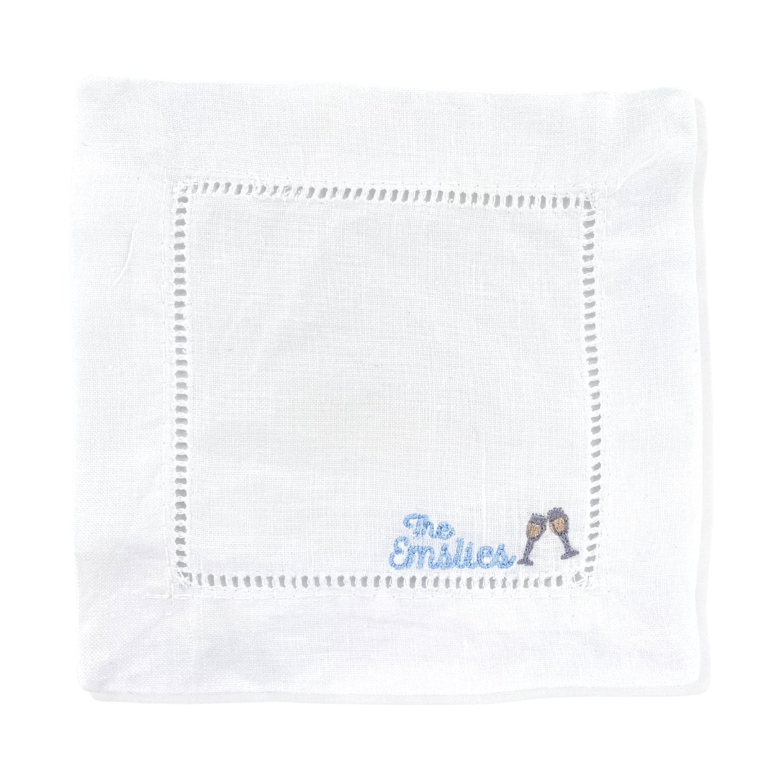 A cocktail napkin with a custom embroidered name and cocktail motif. 