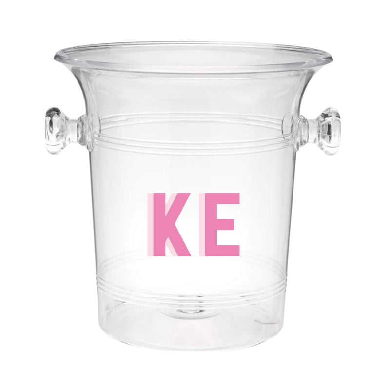 A clear ice bucket with "KE" monogrammed on the front in pink